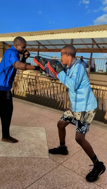 Boxing pad work session with a client in Nairobi