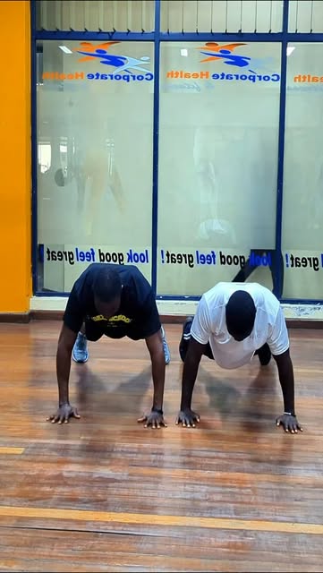 Partner push-up workout led by a Nairobi fitness coach