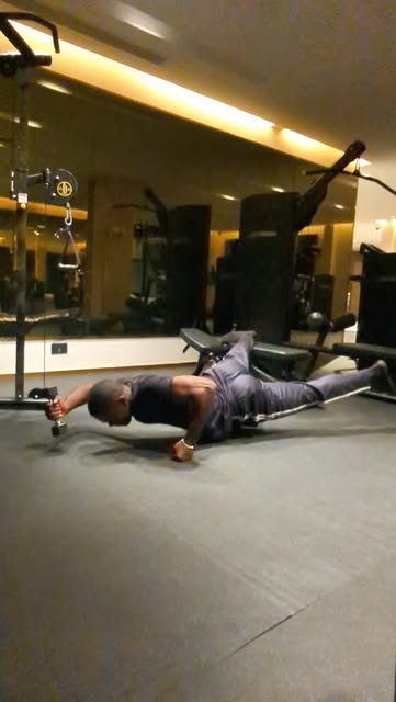 Personal trainer in Nairobi doing a core strength drill in the gym